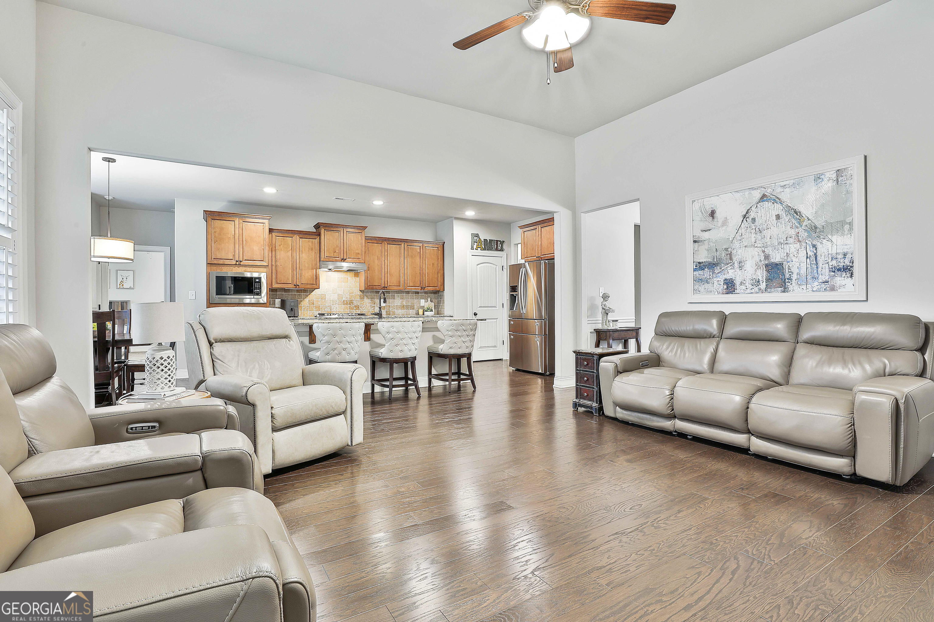 155 Wet Stone Road Senoia, GA 30276 - Photo 12 of 46 a living room with furniture and a large window