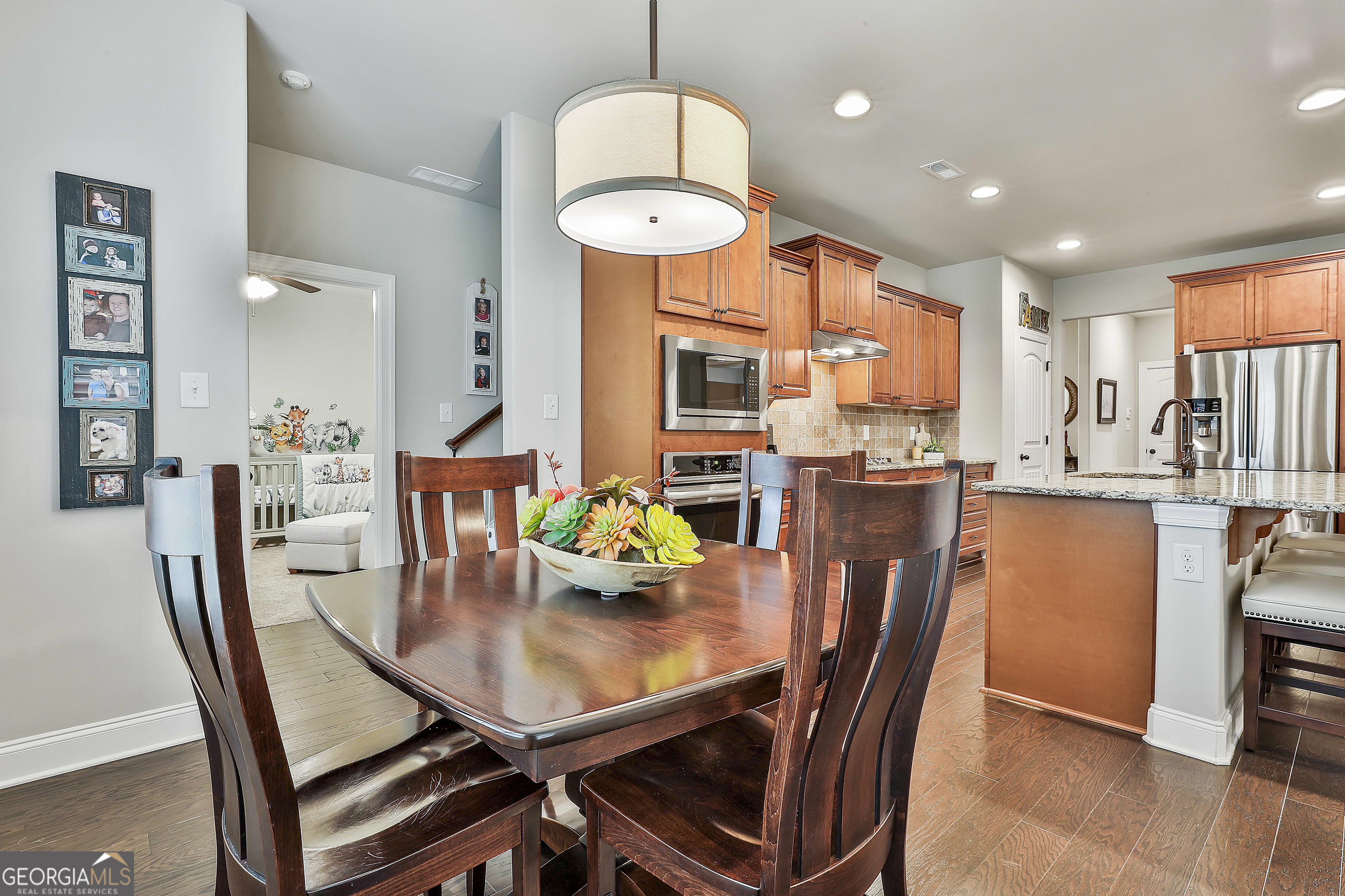 155 Wet Stone Road Senoia, GA 30276 - Photo 20 of 46 a dining room with a table chairs and a dining table