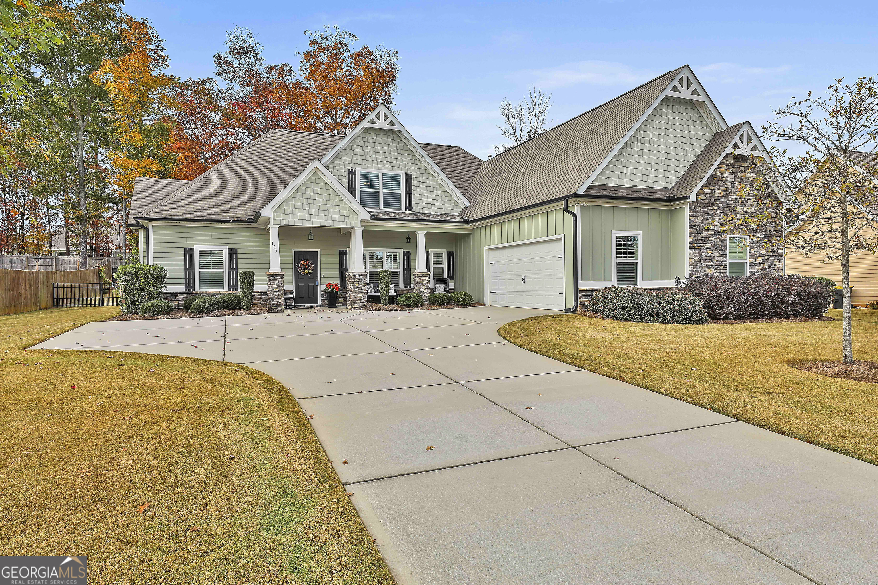 155 Wet Stone Road Senoia, GA 30276 - Photo 2 of 46 a front view of house with yard and trees around