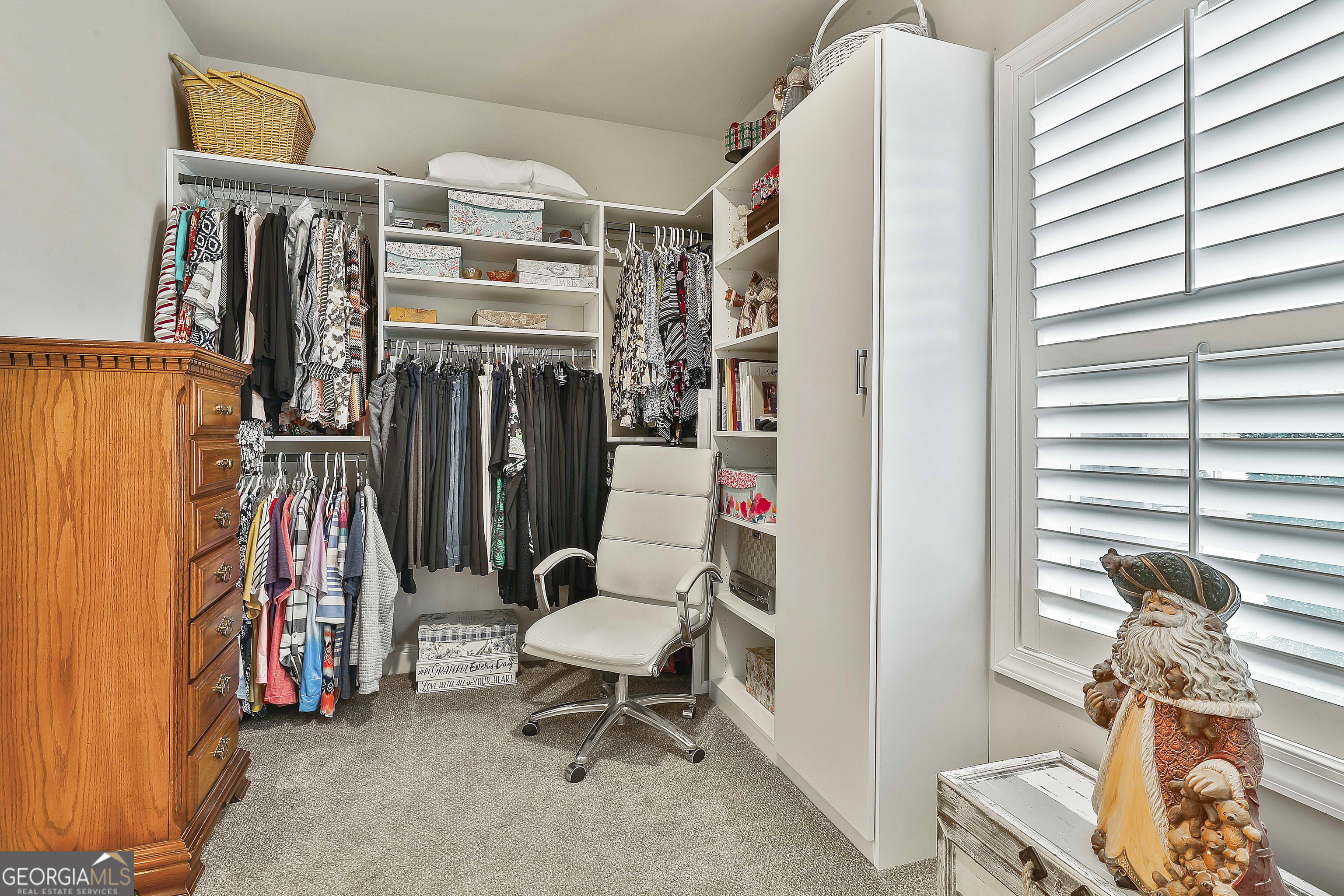 155 Wet Stone Road Senoia, GA 30276 - Photo 29 of 46 a living room with lots of furniture and a window