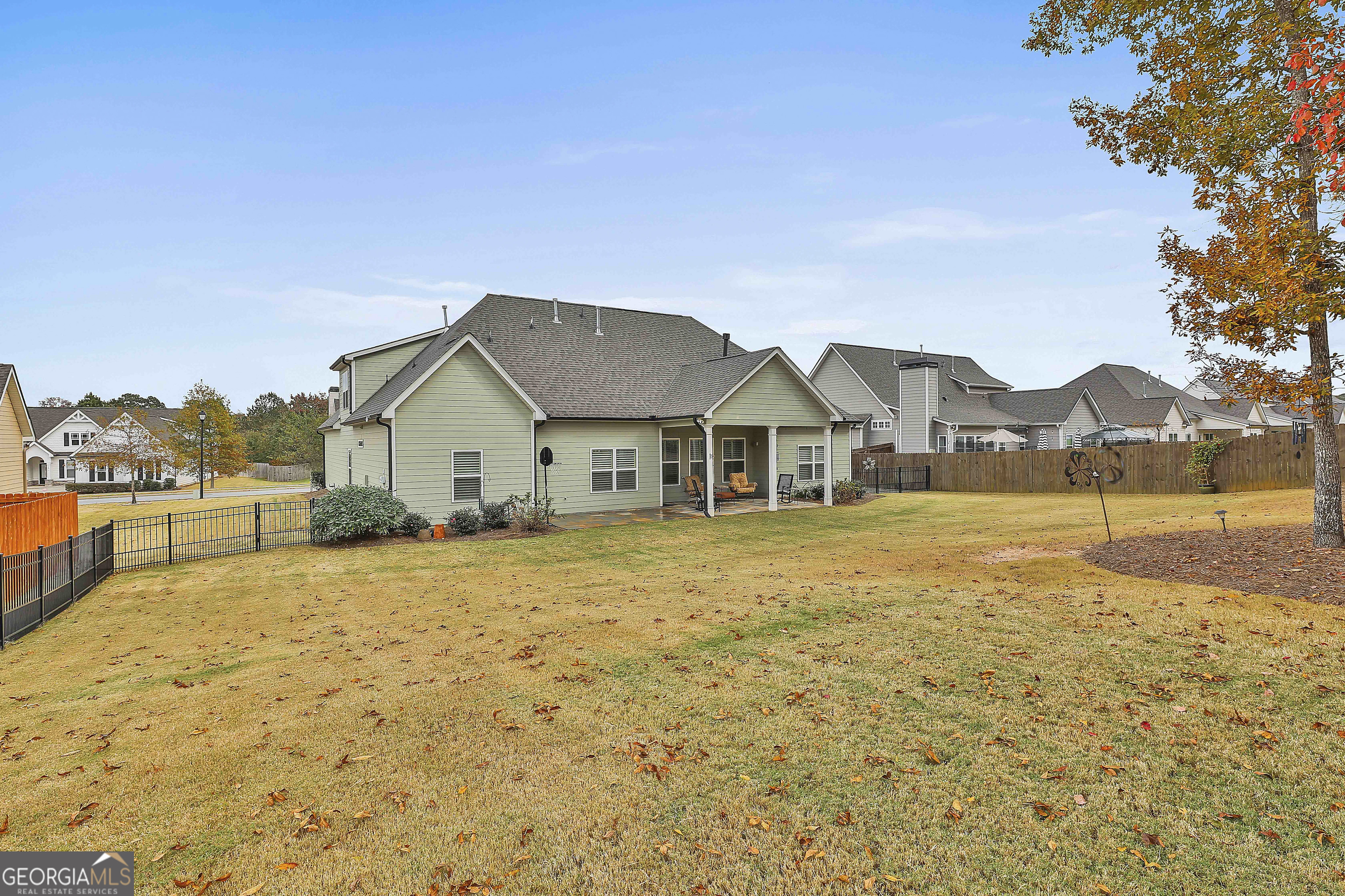 155 Wet Stone Road Senoia, GA 30276 - Photo 45 of 46 a front view of house with yard and trees in the background