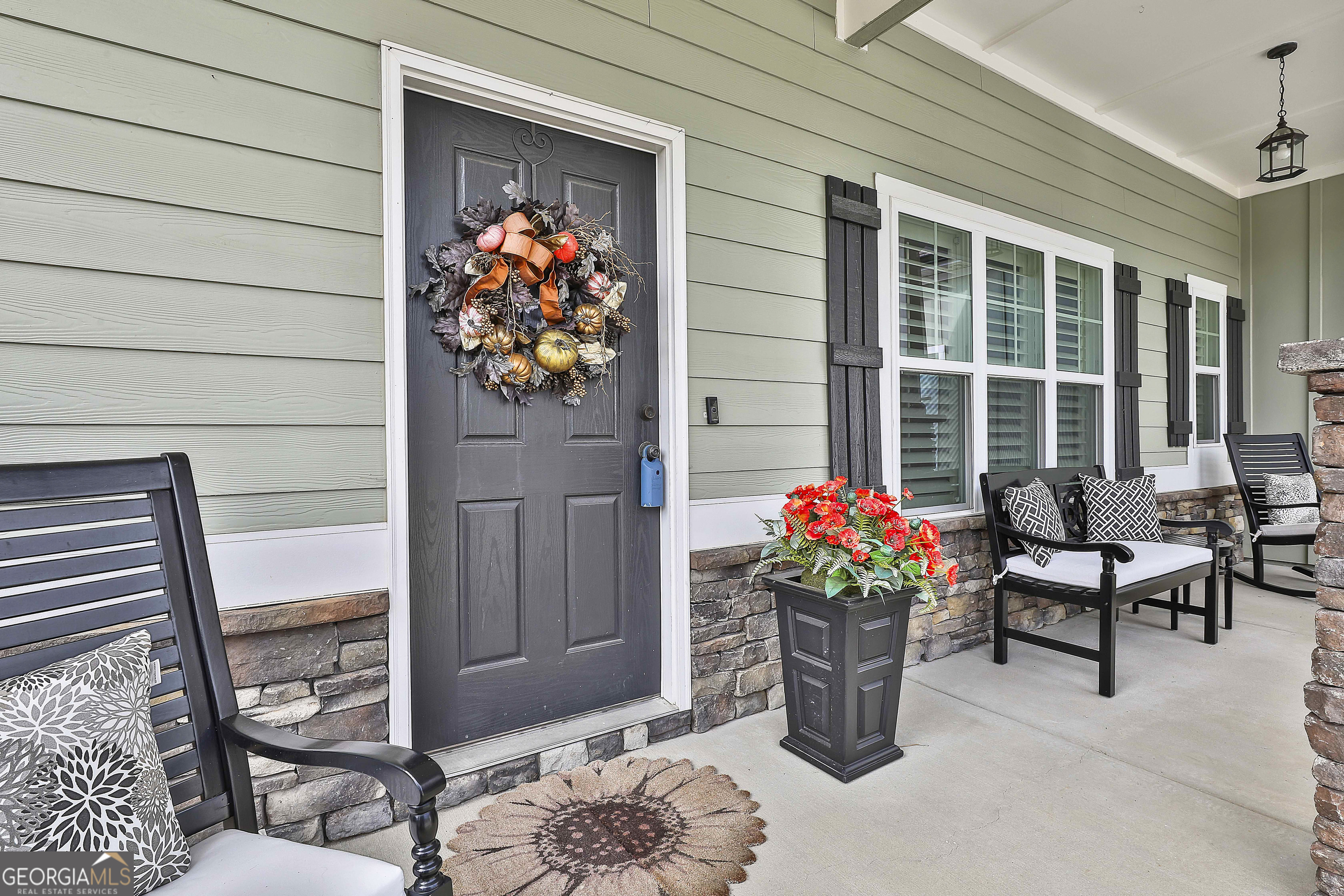 155 Wet Stone Road Senoia, GA 30276 - Photo 6 of 46 a front view of a house with outdoor seating