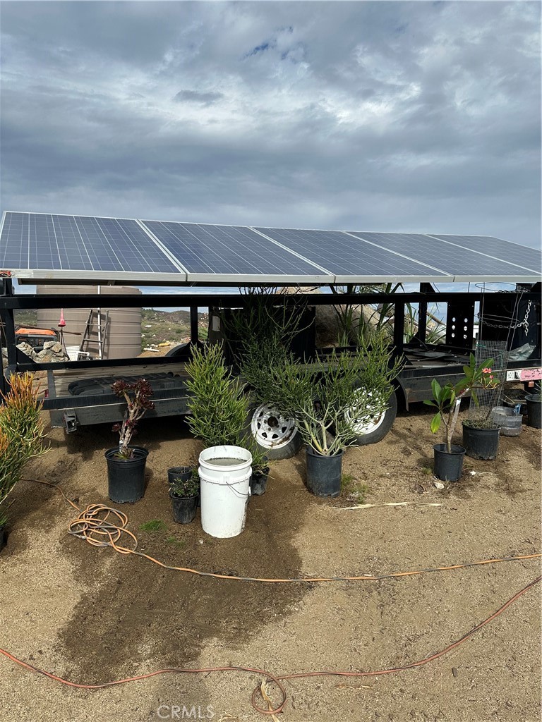 41720 Oak Canyon Road Hemet, CA 92544 - Photo 23 of 60 a view of a porch with furniture and a potted plants