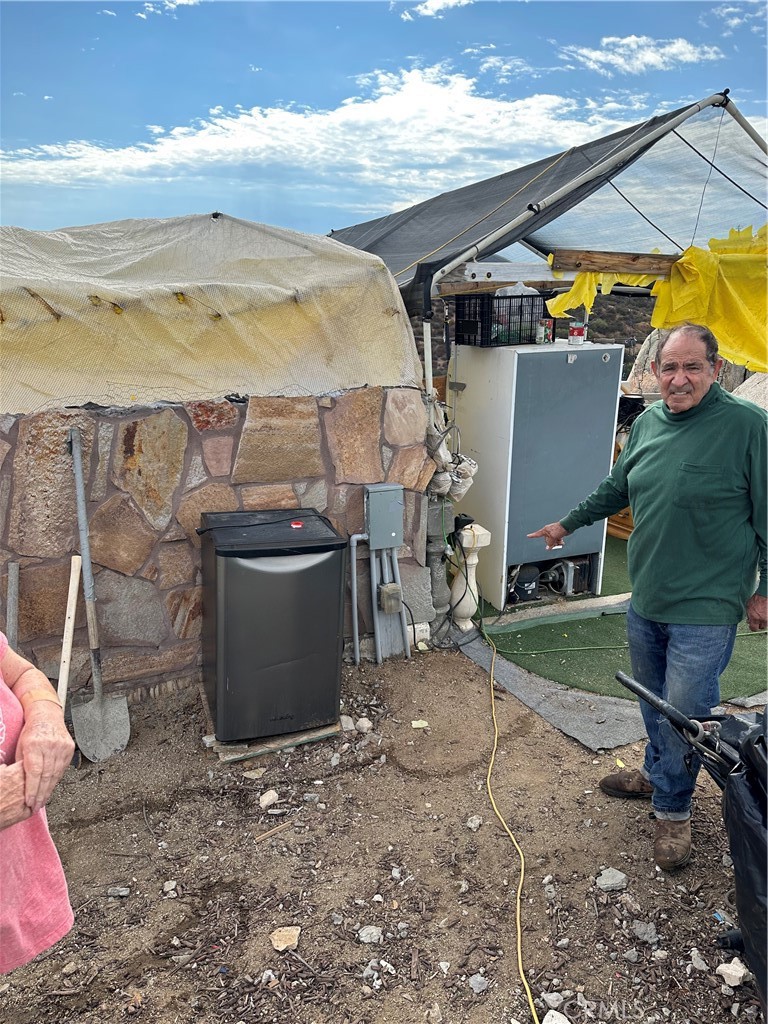 41720 Oak Canyon Road Hemet, CA 92544 - Photo 26 of 60 a view of a backyard with sitting area