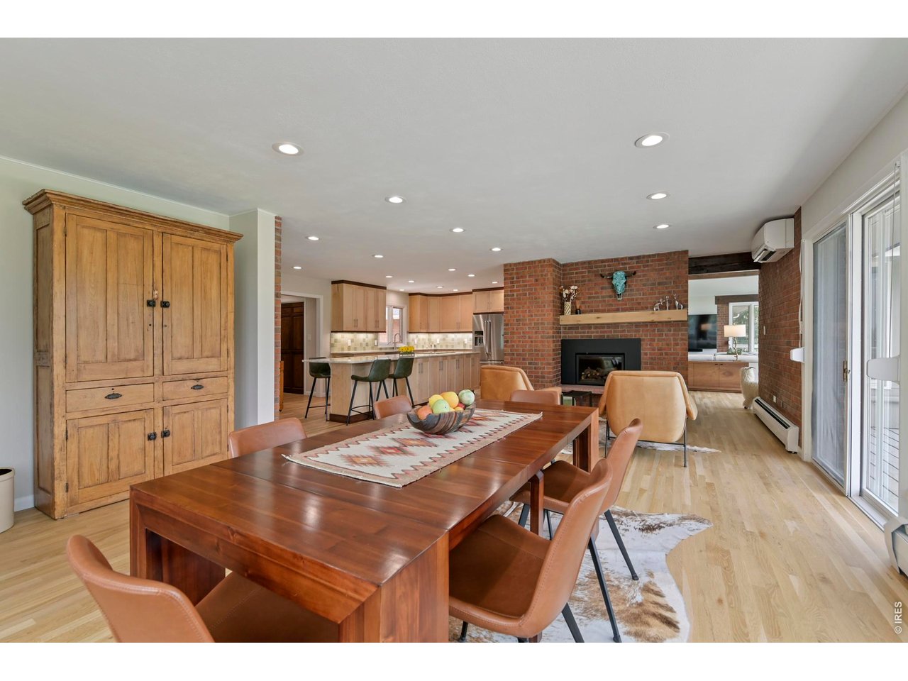19 Ridge Road Boulder, CO 80303 - Photo 15 of 49 Large Dining area seamless positioned next to kitchen and living room, white oak floors, brick accent and gas fireplace #2