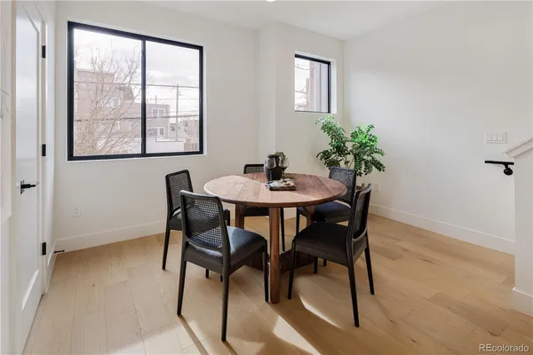 a dining room with furniture and window