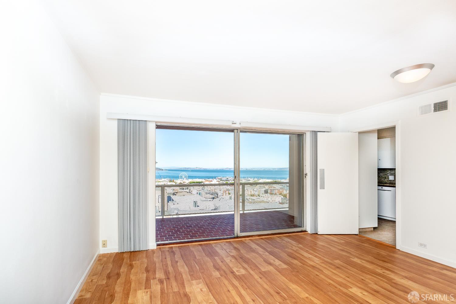 866 Green Street, Unit 5 San Francisco, CA 94133 - Photo 13 of 15 a bedroom with a bed and a large window