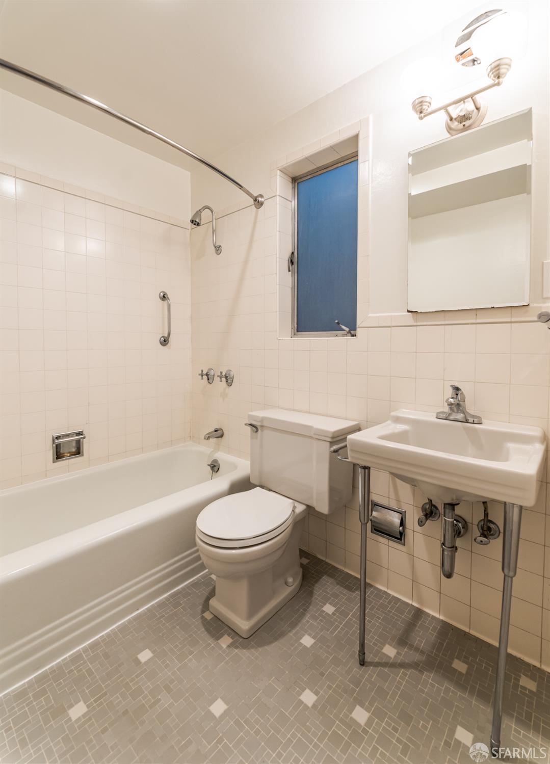 866 Green Street, Unit 5 San Francisco, CA 94133 - Photo 8 of 15 a bathroom with a sink a toilet and shower