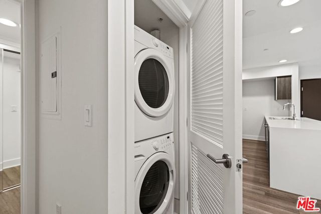 a view of a hallway with washer and dryer