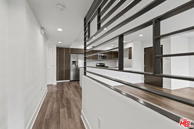 a view of a kitchen with a stove and a refrigerator