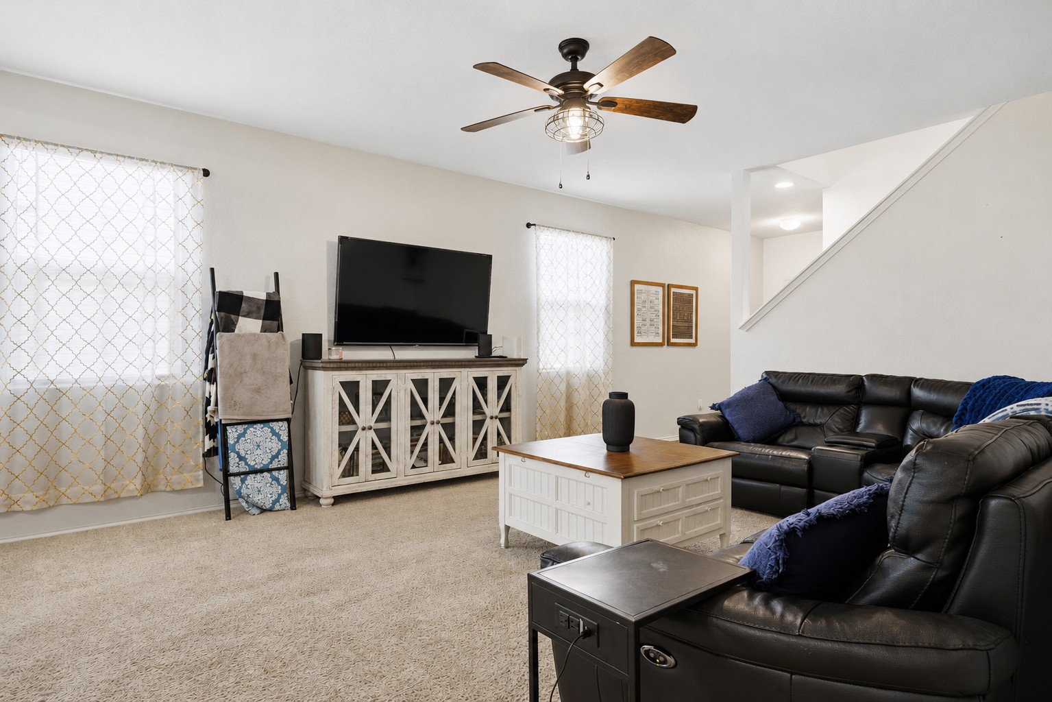 14904 Shalestone Way Manor, TX 78653 - Photo 6 of 32 a living room with furniture and a flat screen tv