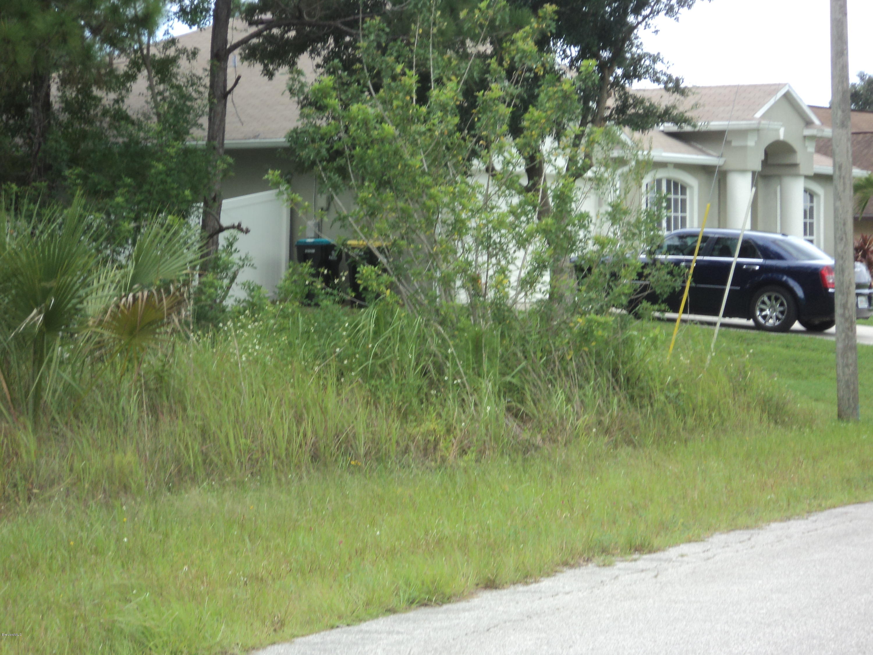 399 Lisa Road Northeast Palm Bay, FL 32907 - Photo 4 of 5 HOME NEXT DOOR