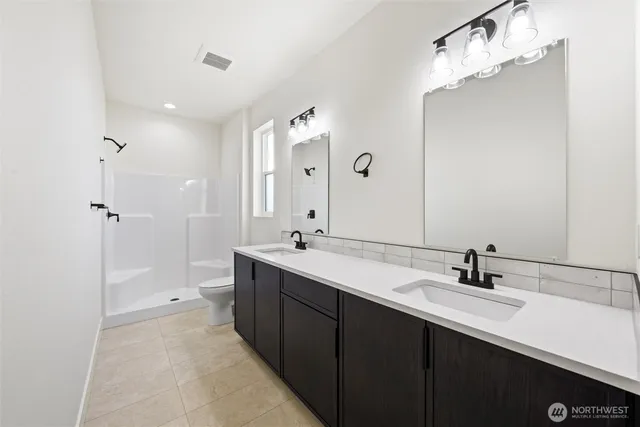 a bathroom with a shower and toilet