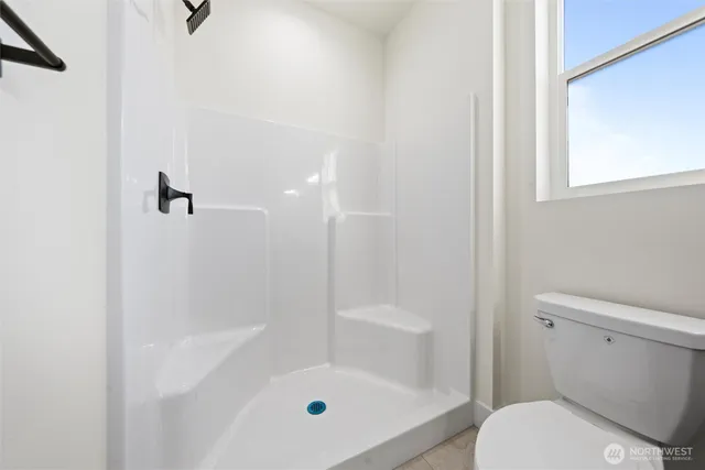 a bathroom with a double vanity sink a and a mirror