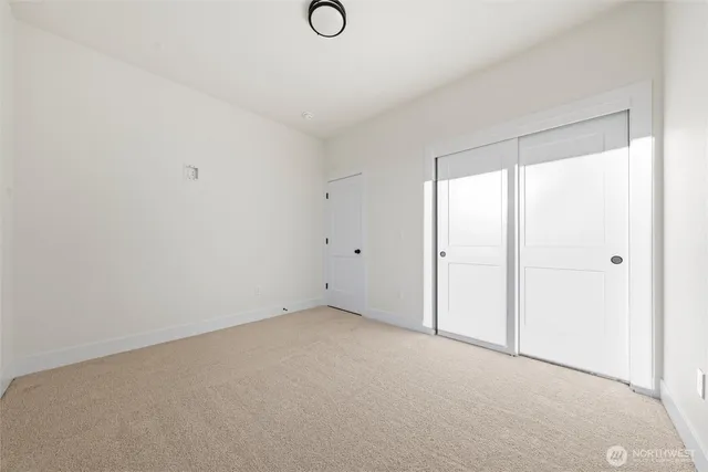 a view of a room with wooden floor and staircase