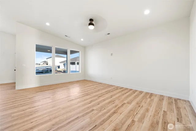 a view of wooden floor and chandelier in a room