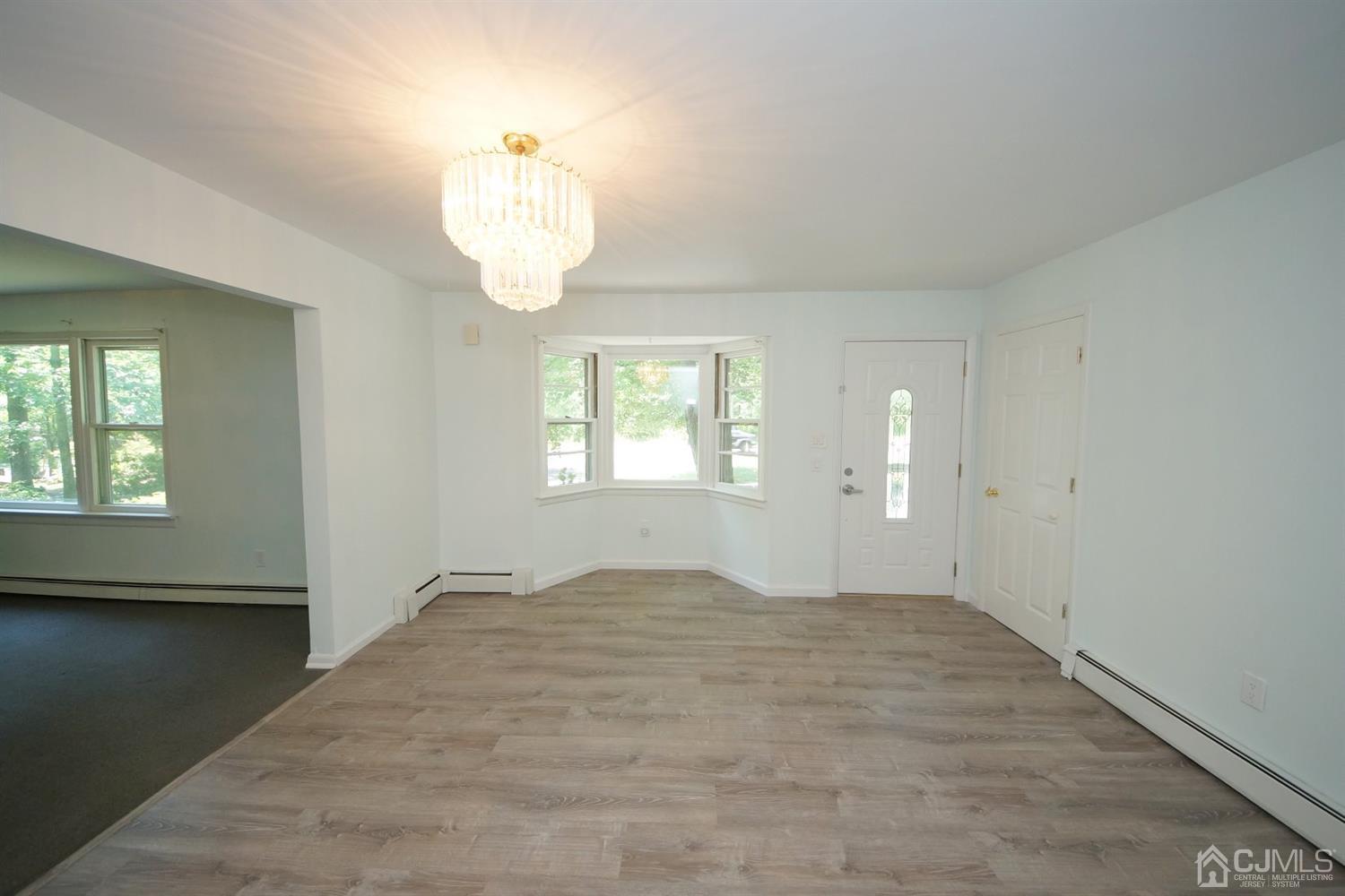 238 New Road Monmouth Junction, NJ 08852 - Photo 12 of 63 an empty room with windows and entrance