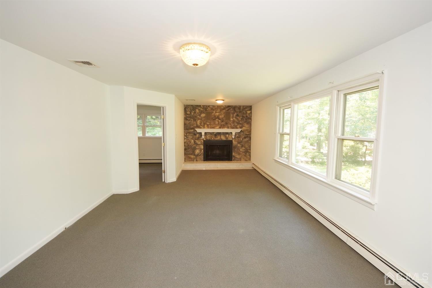238 New Road Monmouth Junction, NJ 08852 - Photo 14 of 63 a view of an empty room with a window