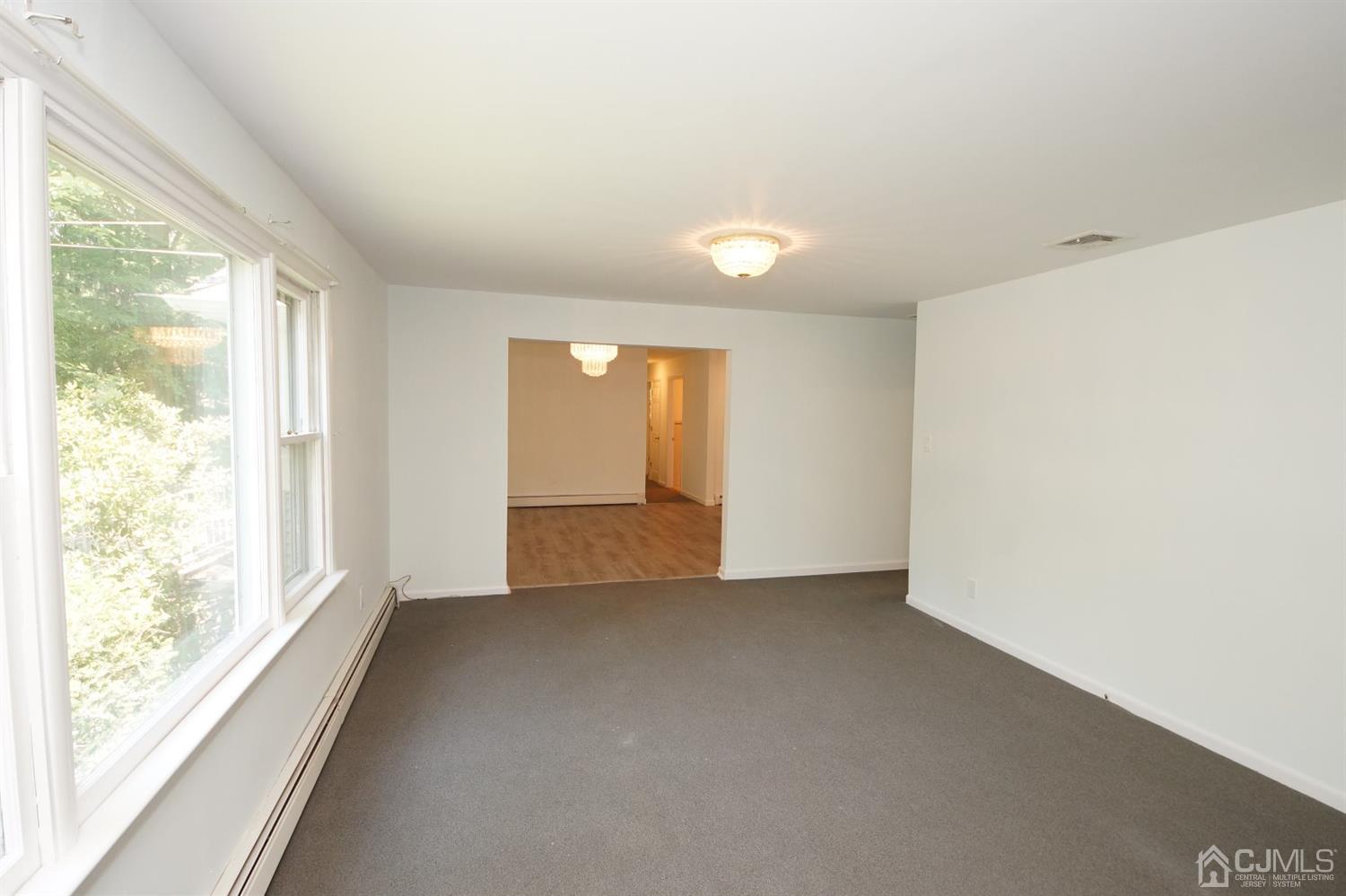 238 New Road Monmouth Junction, NJ 08852 - Photo 16 of 63 a view of an empty room with a window