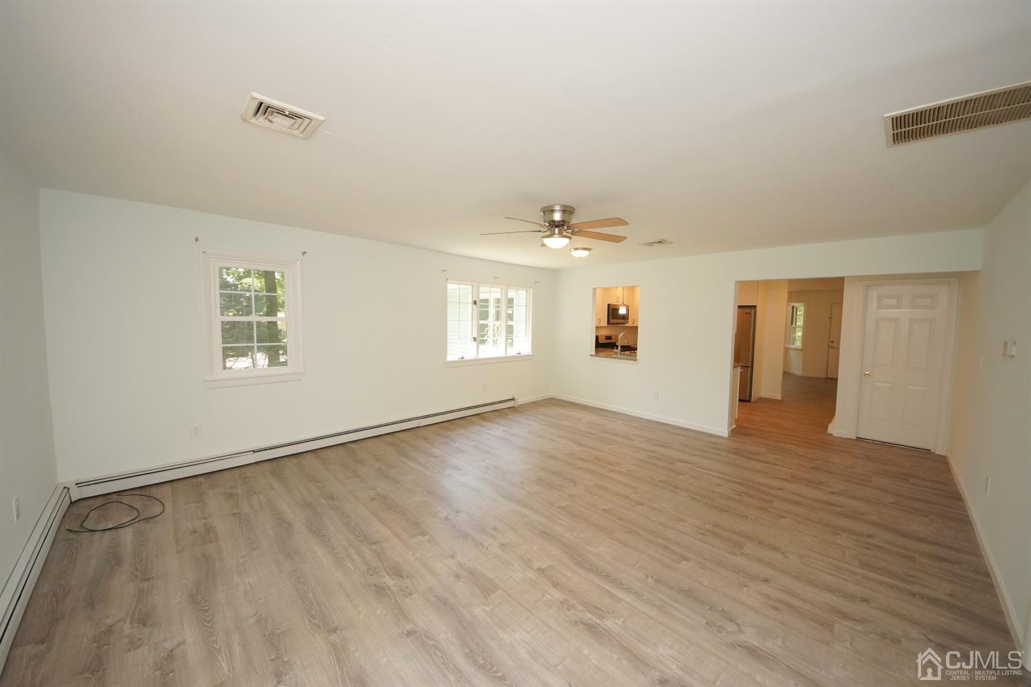 238 New Road Monmouth Junction, NJ 08852 - Photo 24 of 63 an empty room with wooden floor and windows