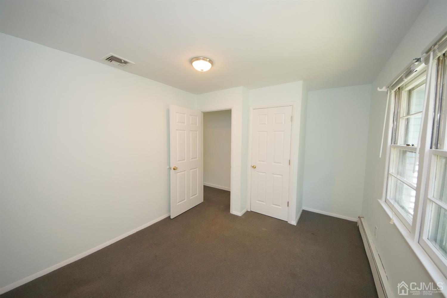 238 New Road Monmouth Junction, NJ 08852 - Photo 35 of 63 a view of a big room with windows and entryway
