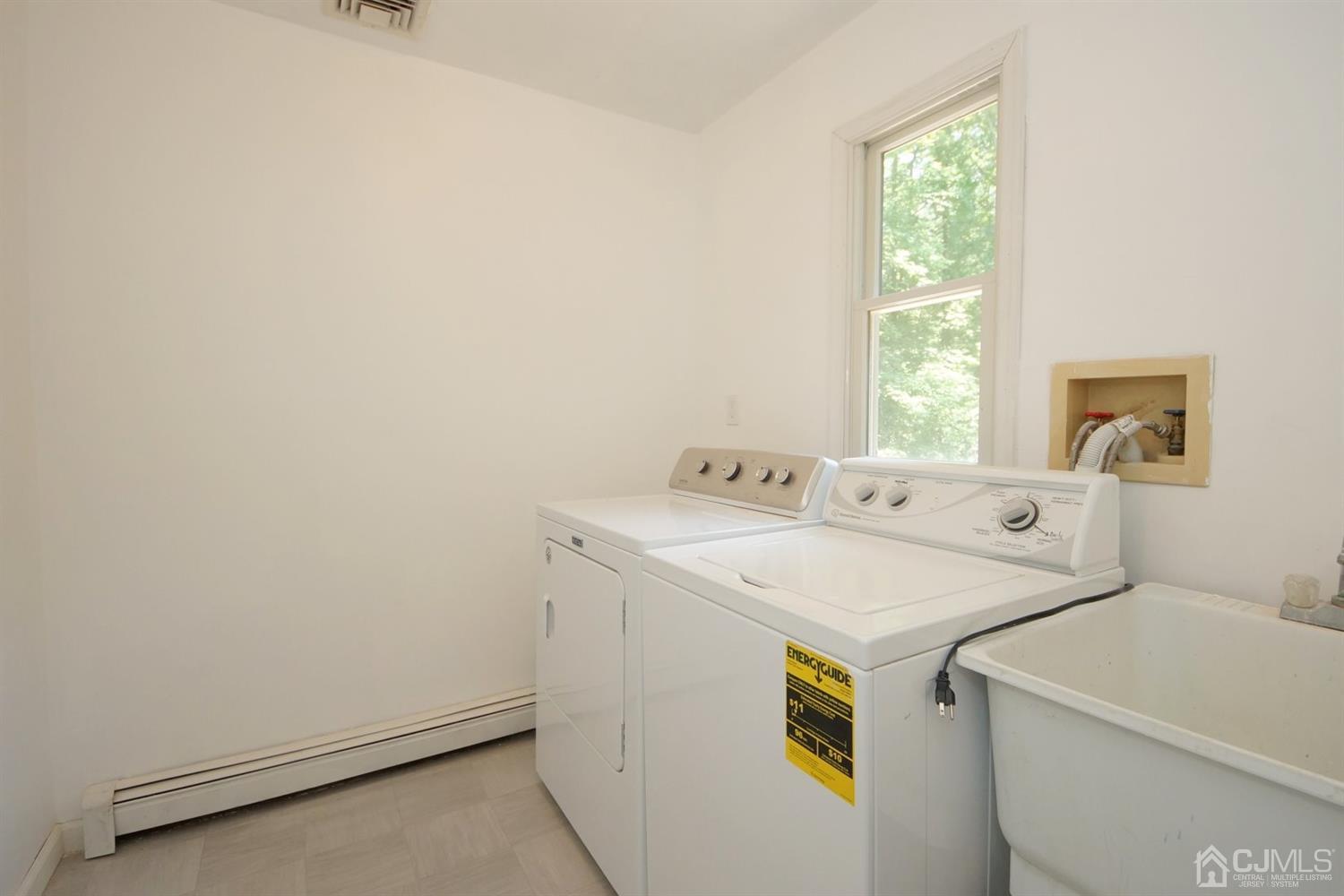 238 New Road Monmouth Junction, NJ 08852 - Photo 36 of 63 a utility room with dryer and washer