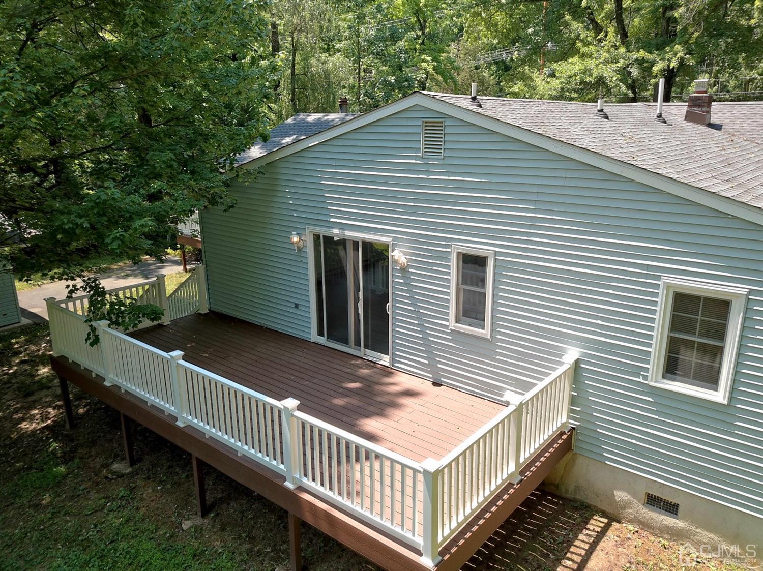 238 New Road Monmouth Junction, NJ 08852 - Photo 48 of 63 a view of a house with a small yard and wooden floor