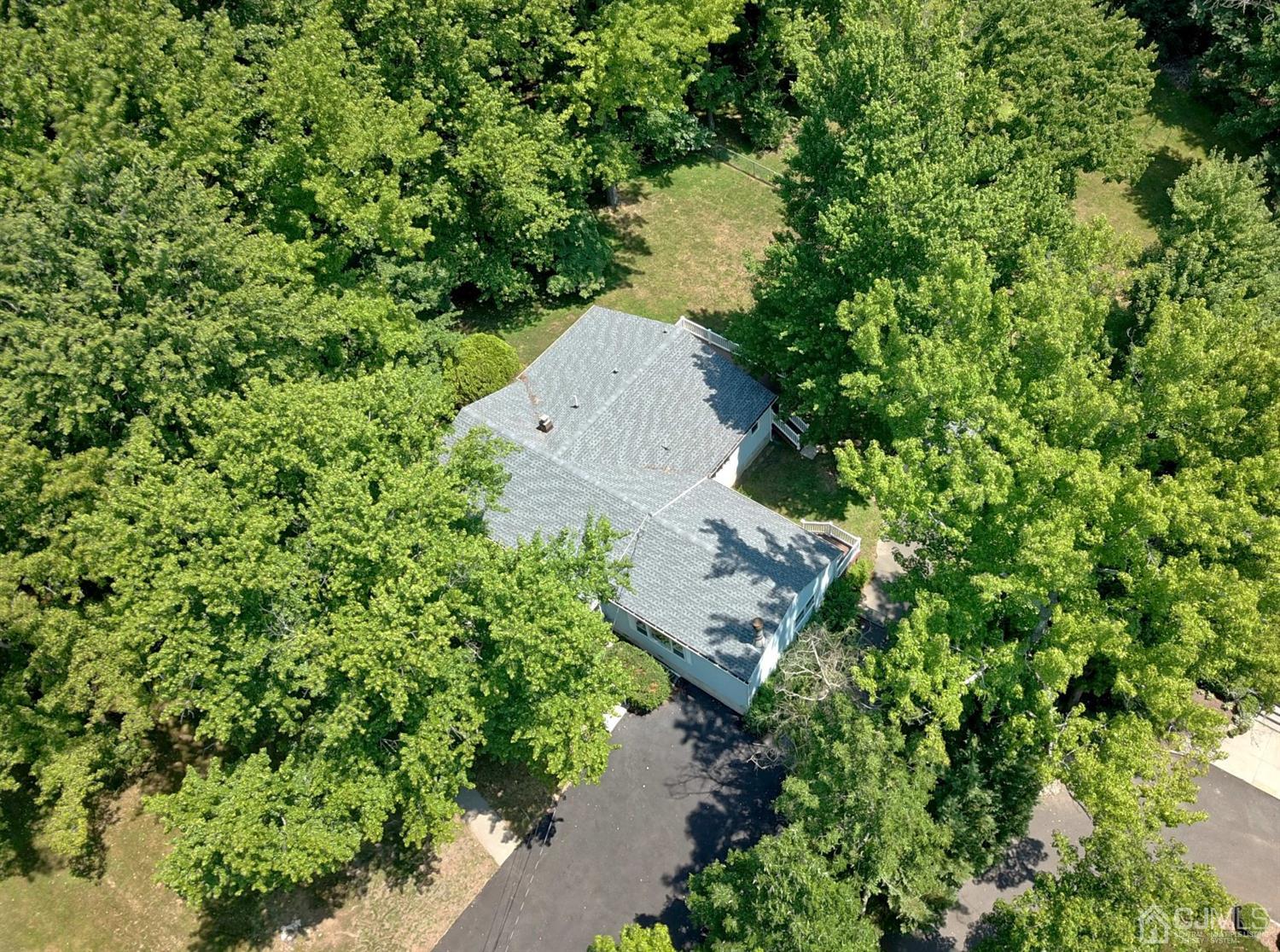 238 New Road Monmouth Junction, NJ 08852 - Photo 7 of 63 an aerial view of a house with a yard and lake view