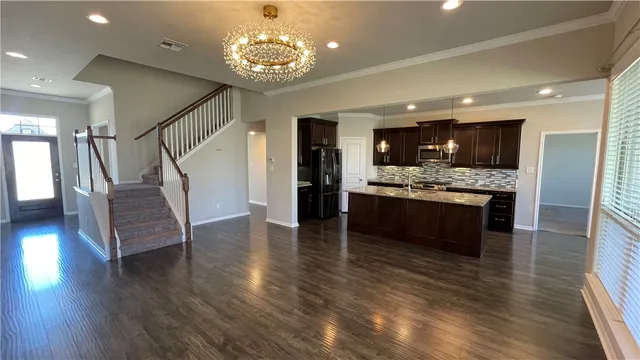a view of kitchen with cabinets and wooden floor