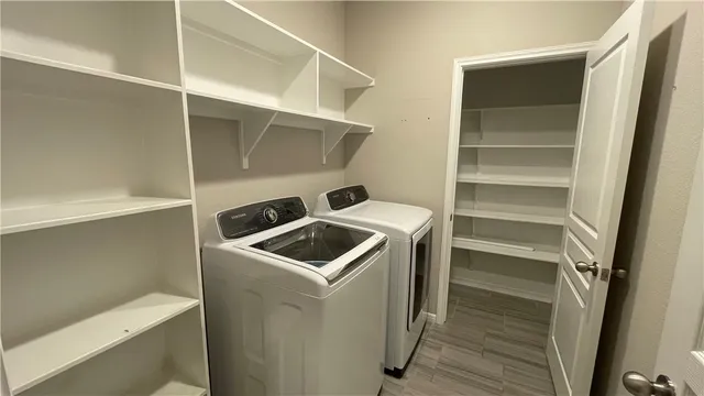 a utility room with washer and dryer