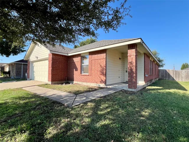 a house view with a backyard space