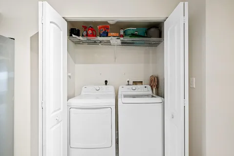 a utility room with dryer and washer
