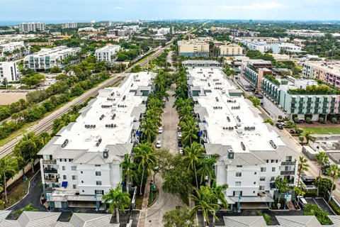 an aerial view of residential houses with outdoor space
