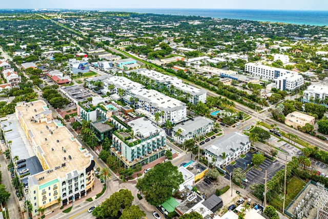 an aerial view of residential houses with outdoor space