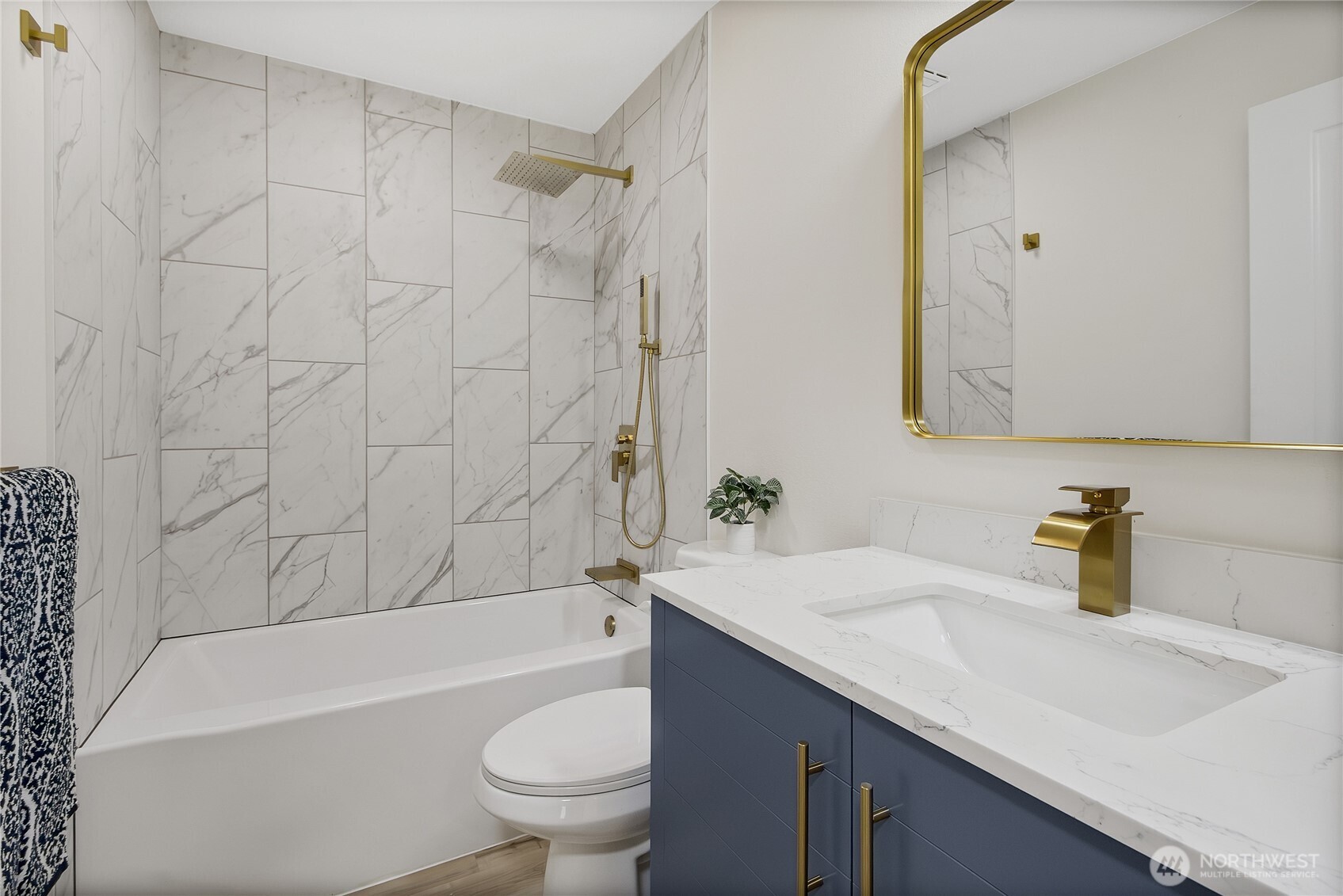 99 Sumner Avenue Sumner, WA 98390 - Photo 13 of 27 a bathroom with a sink a toilet and shower