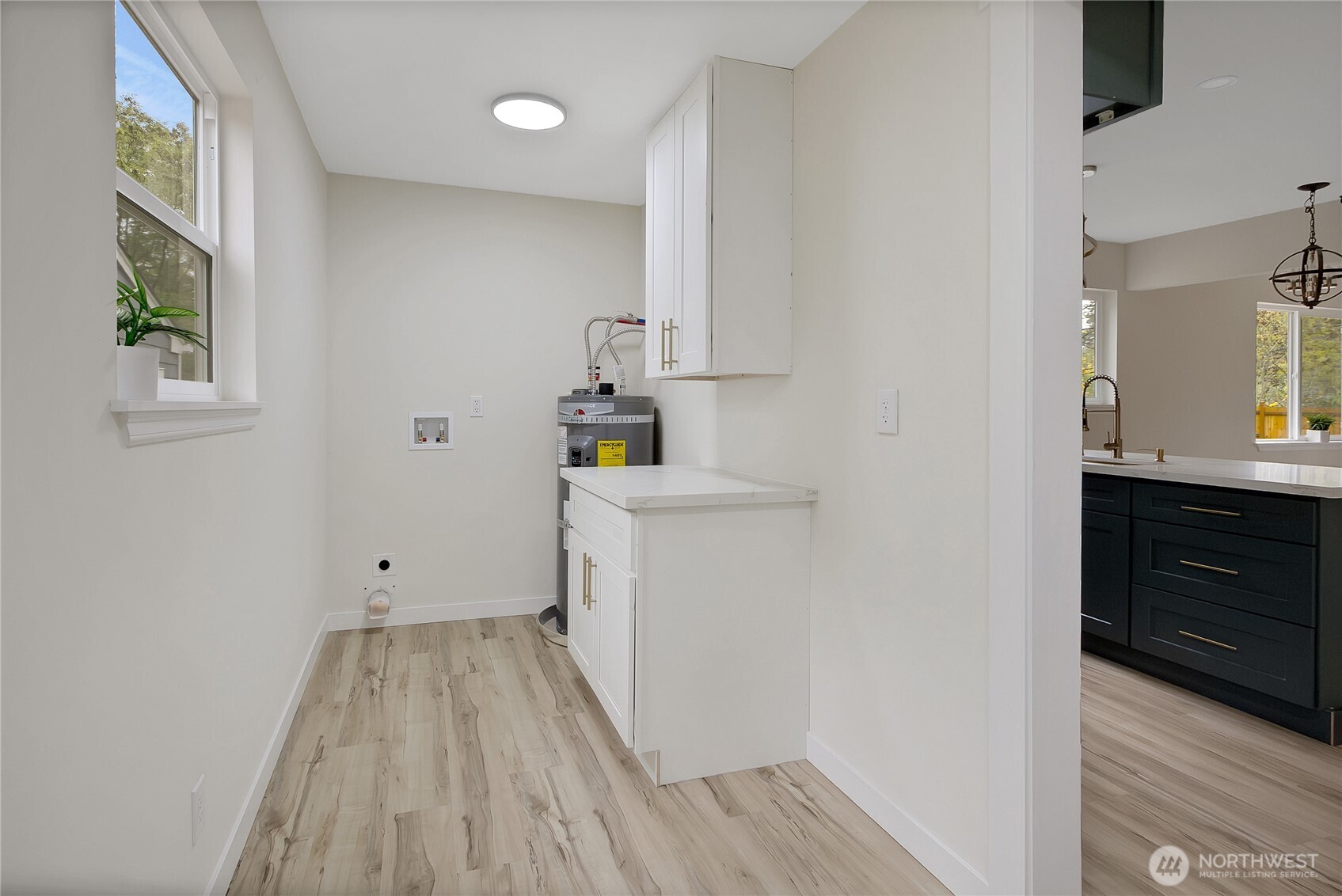 99 Sumner Avenue Sumner, WA 98390 - Photo 14 of 27 a bathroom with a sink and a mirror