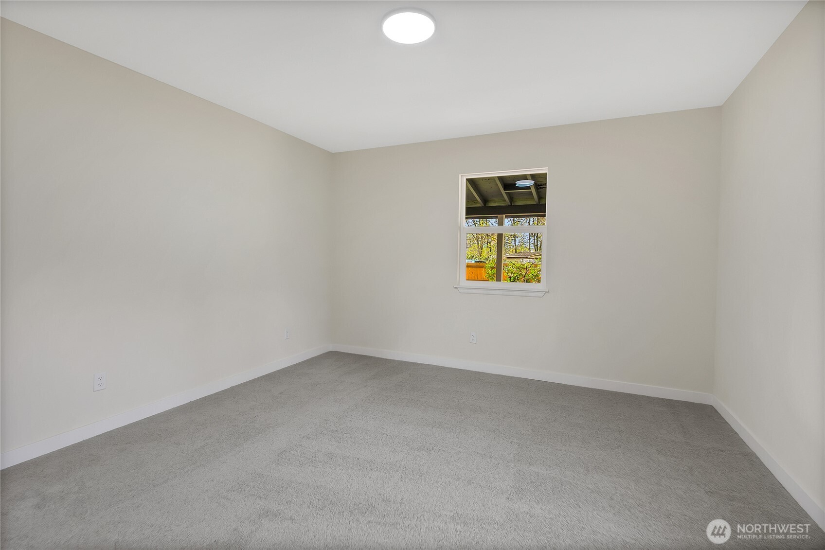 99 Sumner Avenue Sumner, WA 98390 - Photo 16 of 27 an empty room with a window