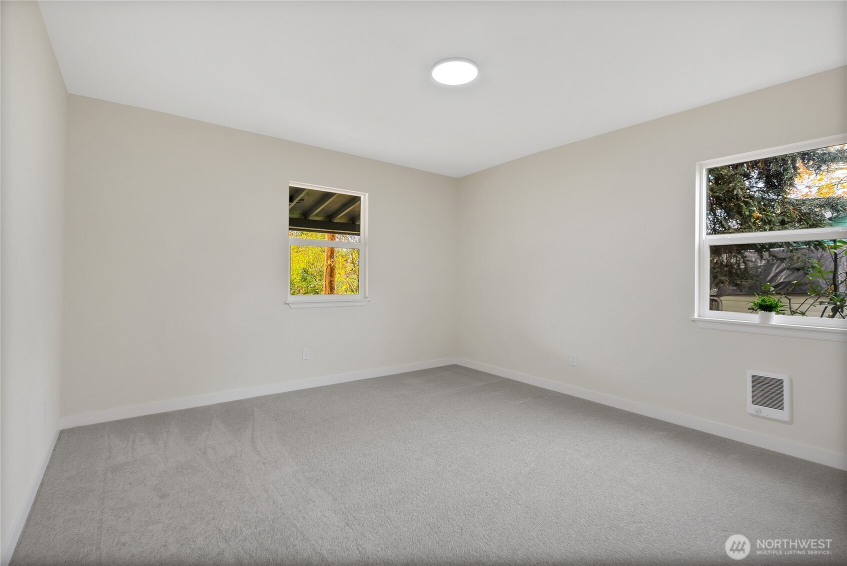 99 Sumner Avenue Sumner, WA 98390 - Photo 17 of 27 an empty room with windows