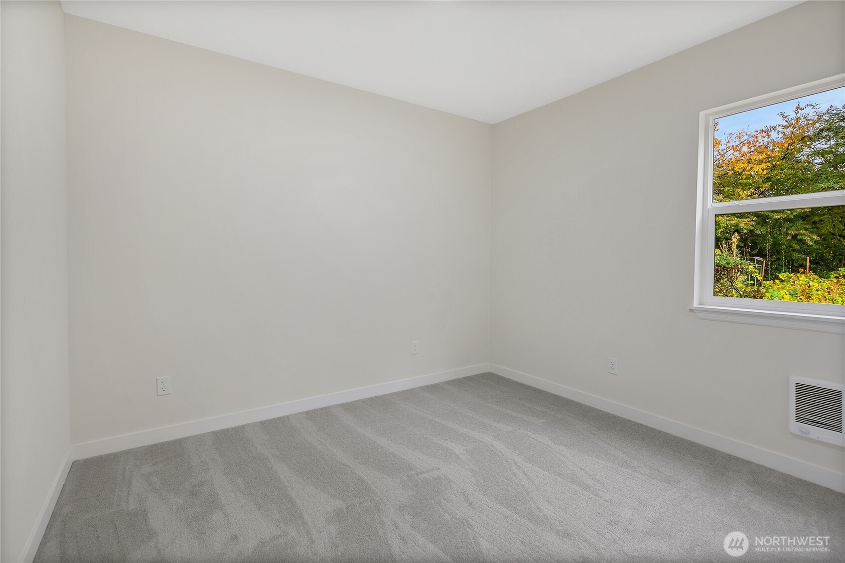 99 Sumner Avenue Sumner, WA 98390 - Photo 19 of 27 wooden floor in an empty room with a window