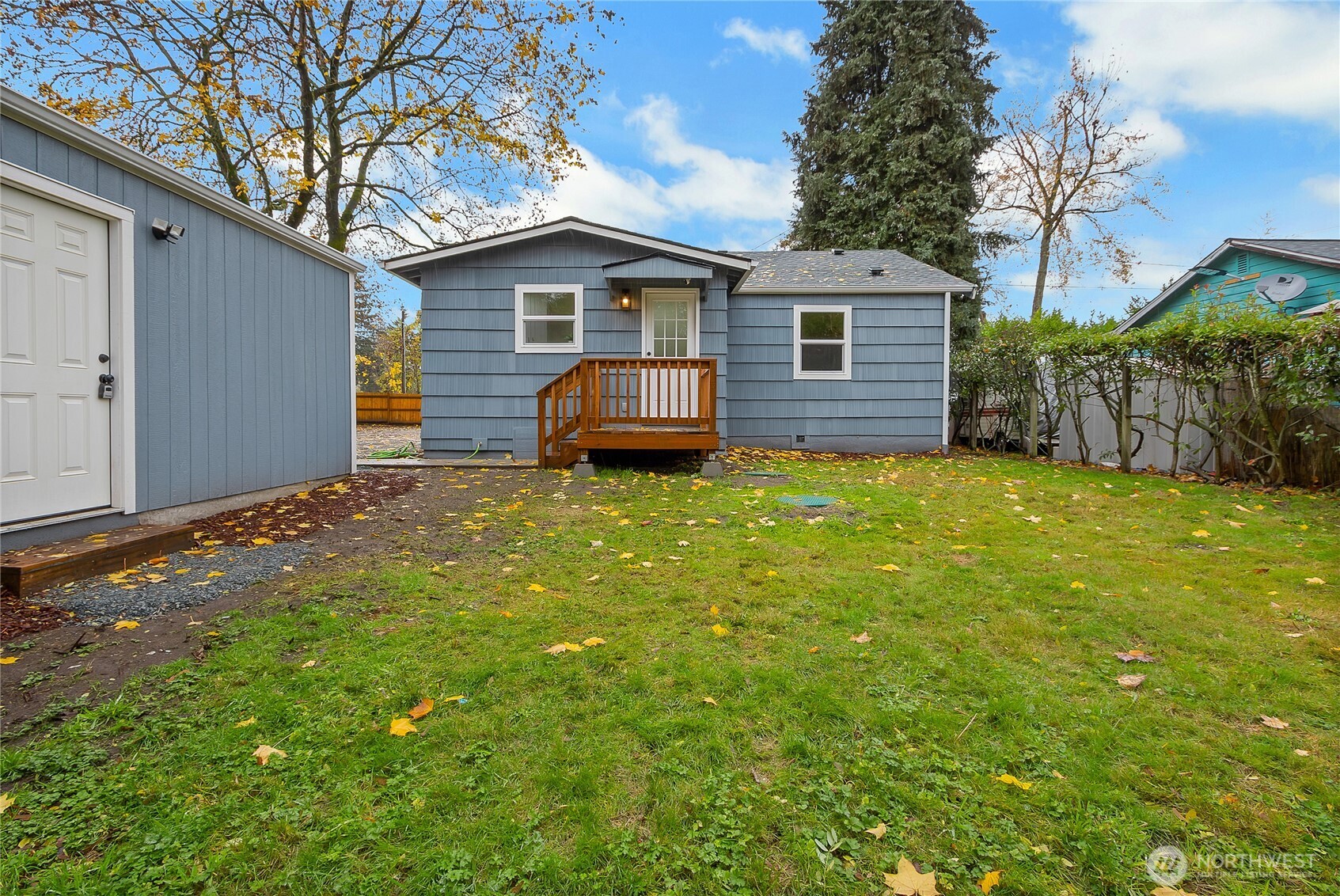 99 Sumner Avenue Sumner, WA 98390 - Photo 22 of 27 a view of a house with a yard