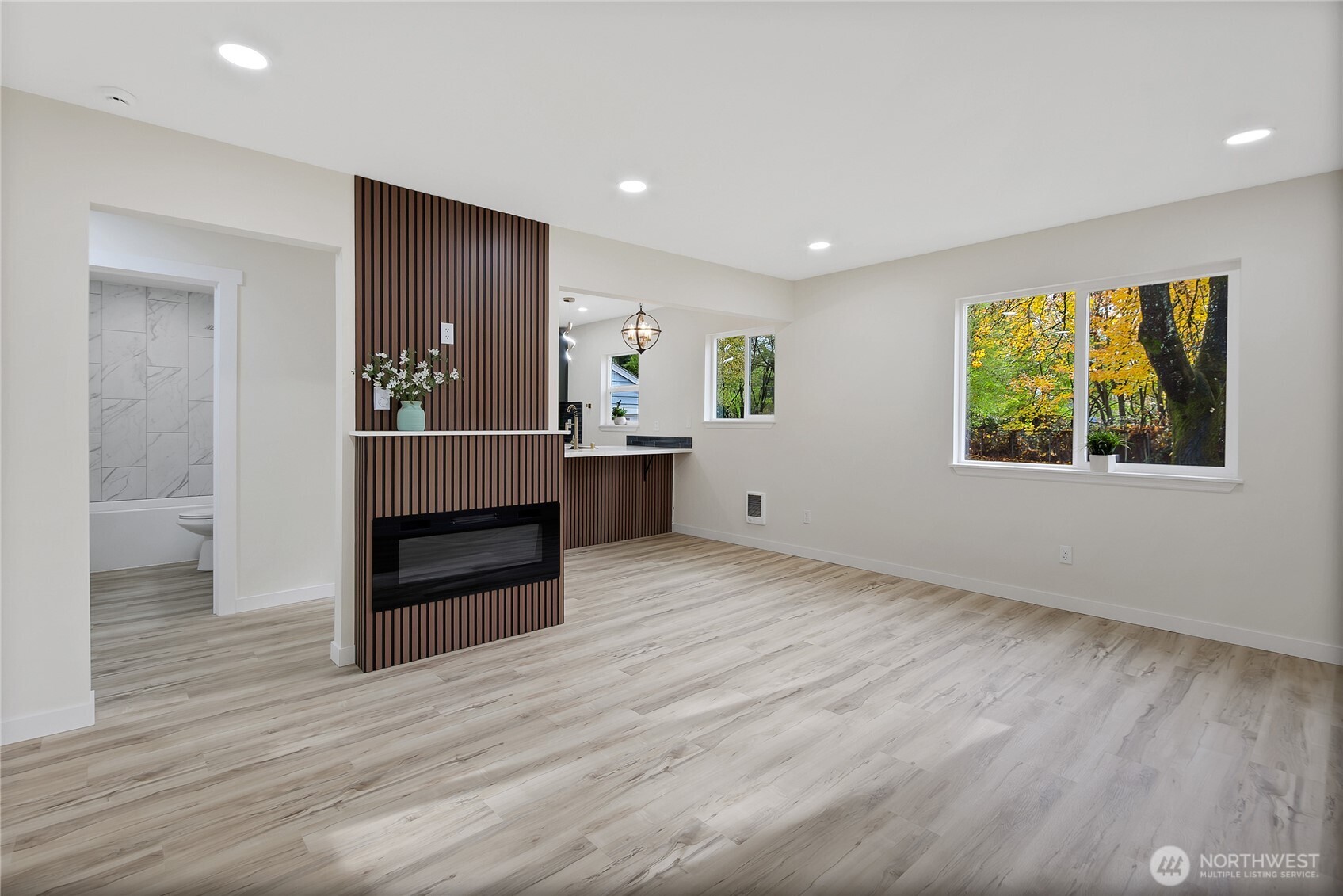 99 Sumner Avenue Sumner, WA 98390 - Photo 4 of 27 wooden floor in an empty room with a window
