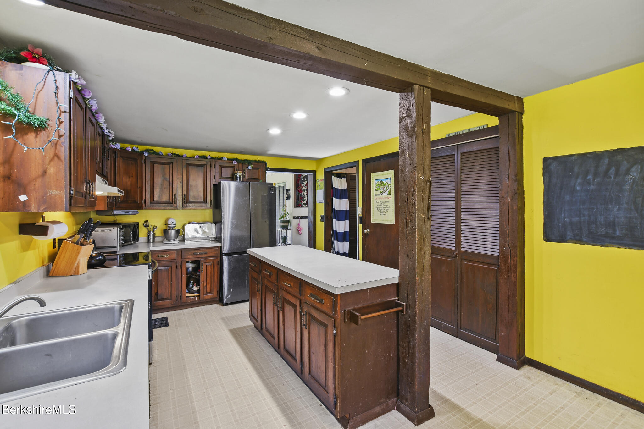 74 Old Main Road Savoy, MA 01256 - Photo 24 of 42 a kitchen with stainless steel appliances granite countertop a sink and cabinets