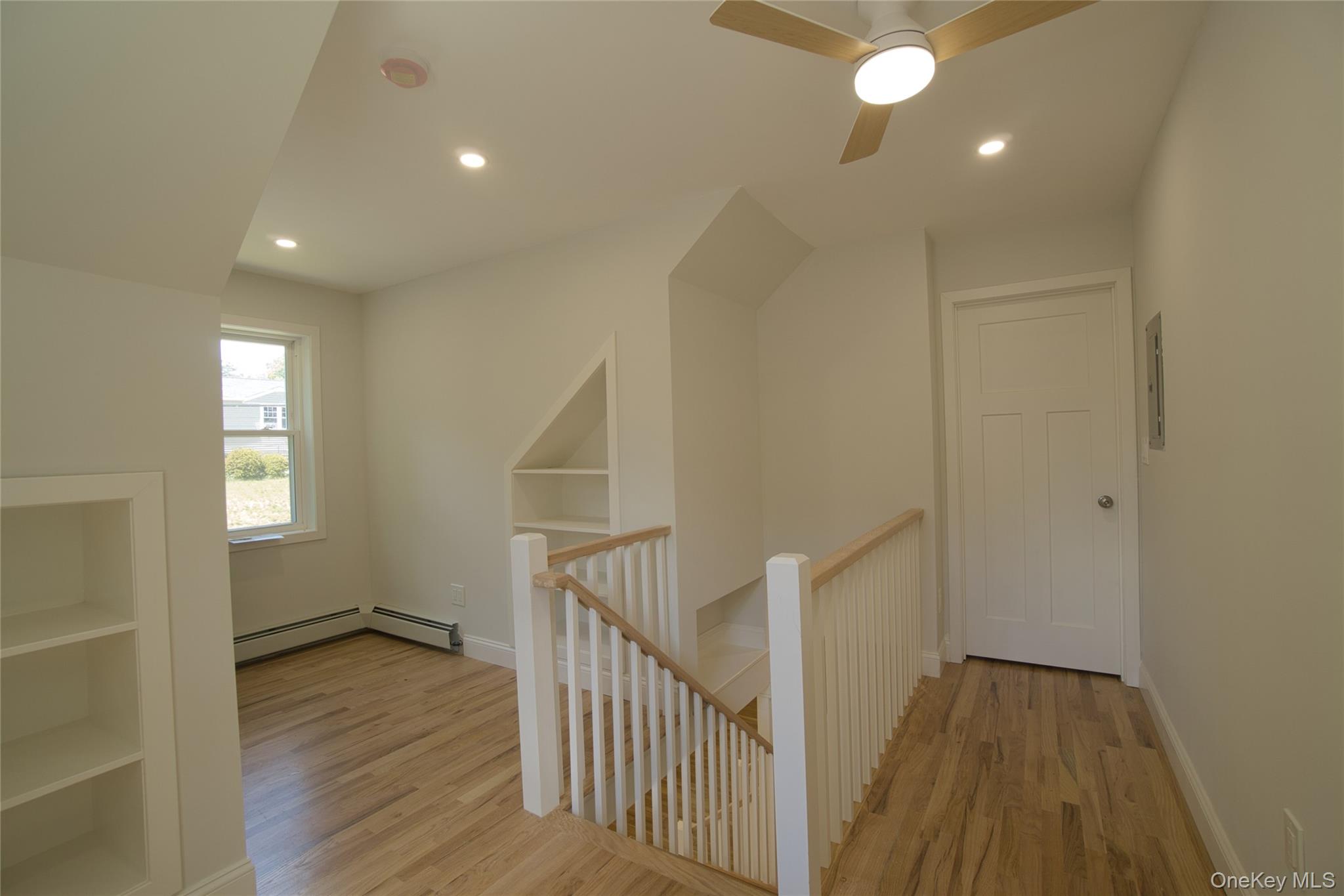 29 Overlin Road Patterson, NY 12563 - Photo 10 of 16 Upper-level hallway featuring wood-finish flooring, recessed lighting, and a modern ceiling fan