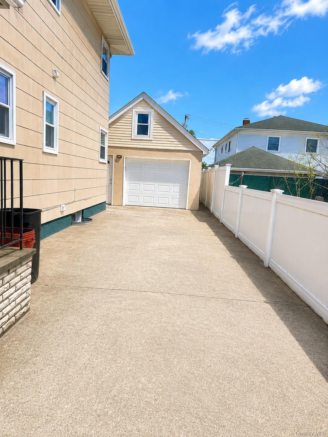 131 Roslyn Road, Unit 1 Mineola, NY 11501 - Photo 16 of 17 a view of a house with a outdoor space
