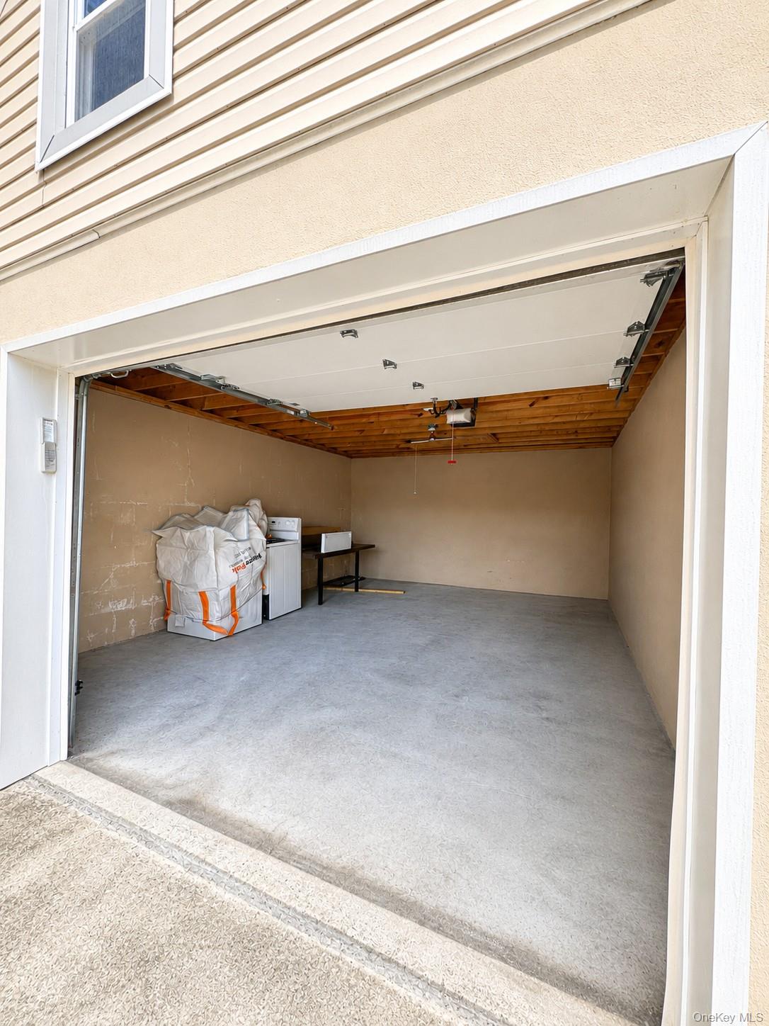 131 Roslyn Road, Unit 1 Mineola, NY 11501 - Photo 17 of 17 a view of parking and garage
