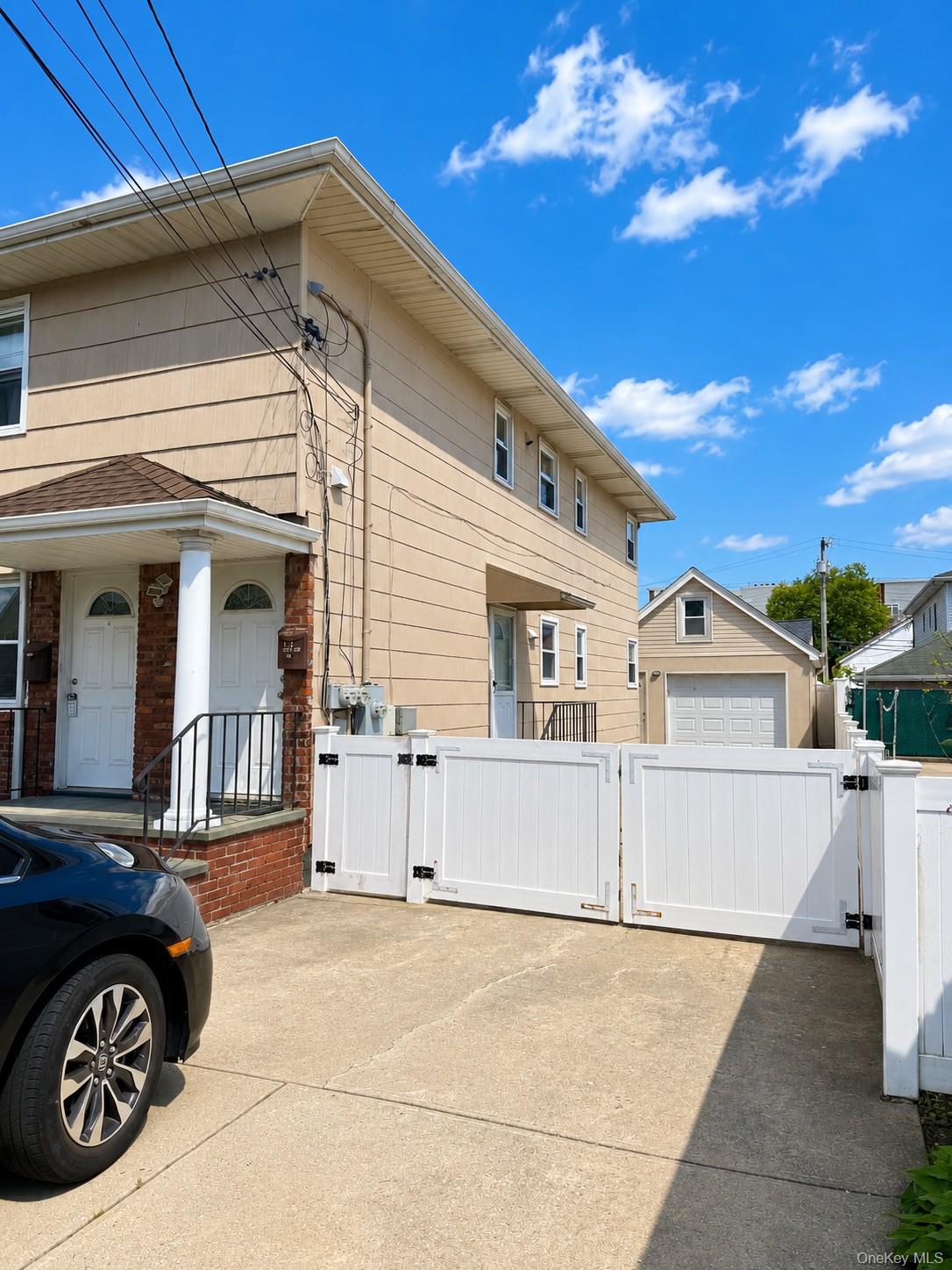 131 Roslyn Road, Unit 1 Mineola, NY 11501 - Photo 5 of 17 a view of a house with a outdoor space