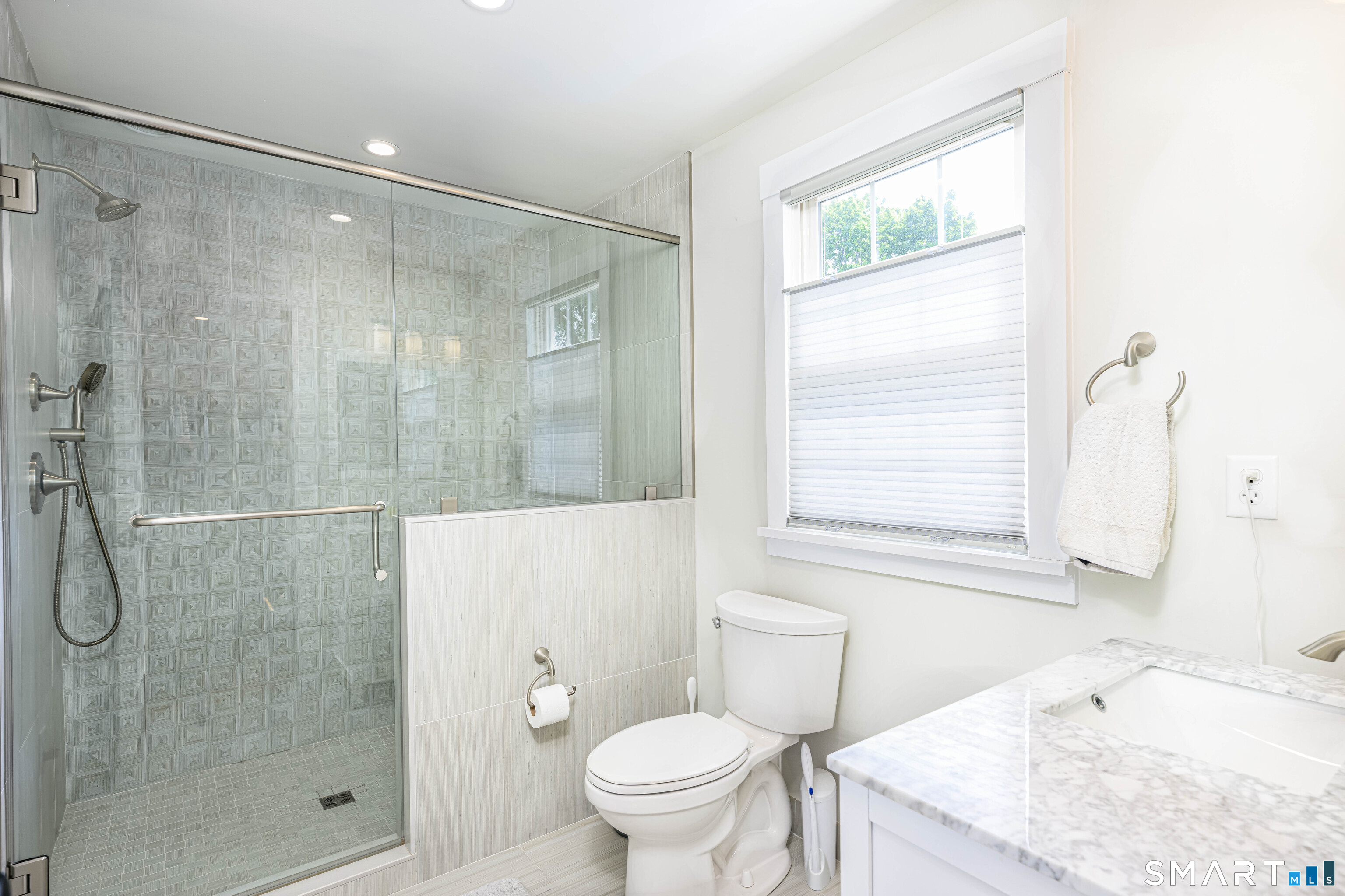 77 Prospect Road East Haven, CT 06512 - Photo 17 of 31 Remodeled, heated floors, this bath is for the 2 bedrooms on the upper level.