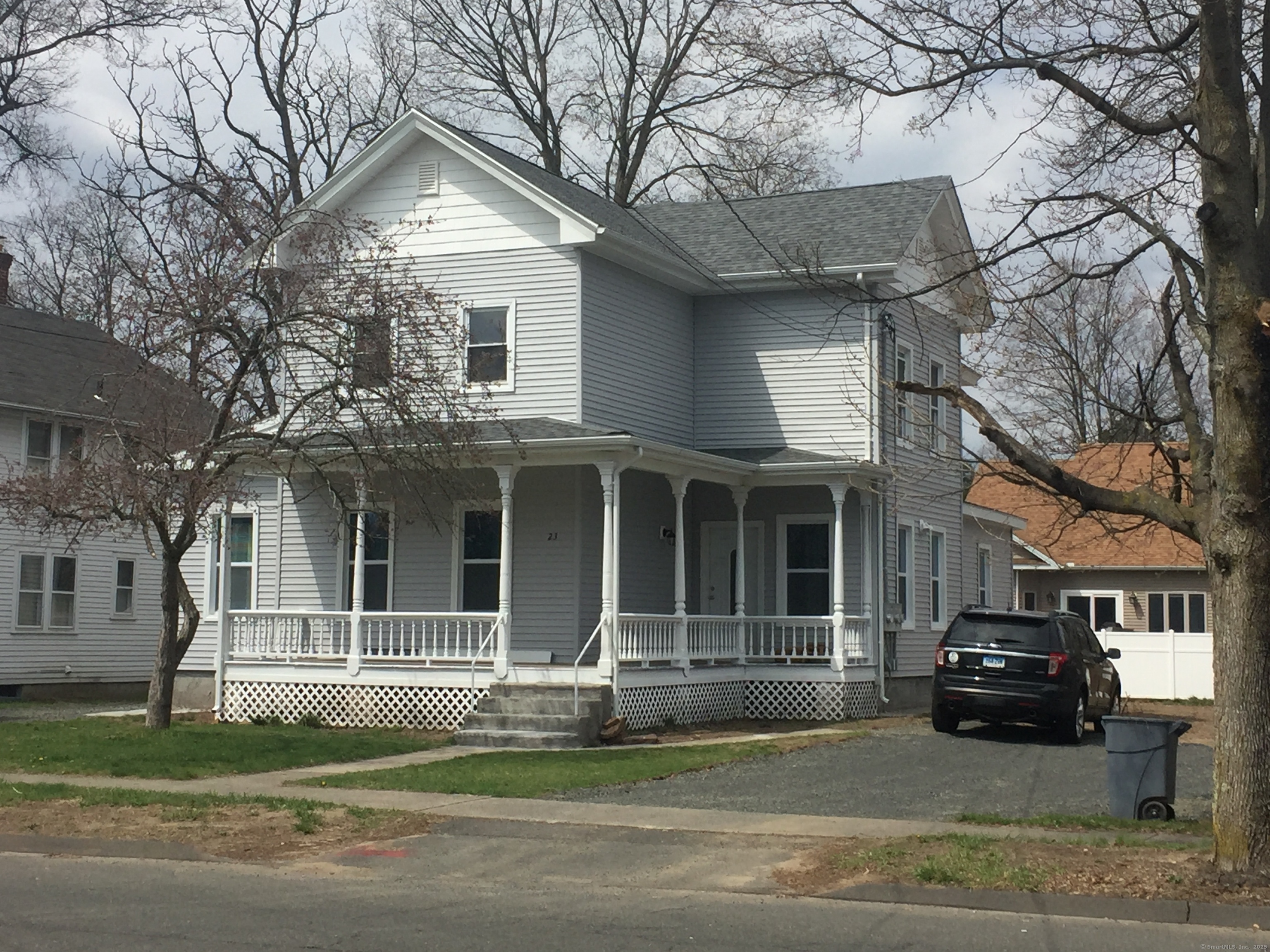 a view of a house with a large tree