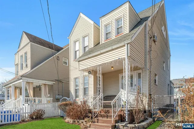 a view of a bedroom with furniture and staircase