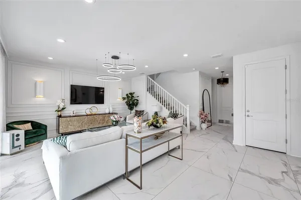 a dining room with furniture and window